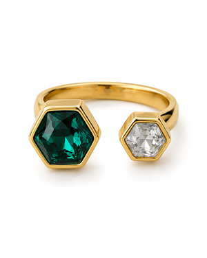 Gold open hexagon ring with green center stone and clear hexagon side stone