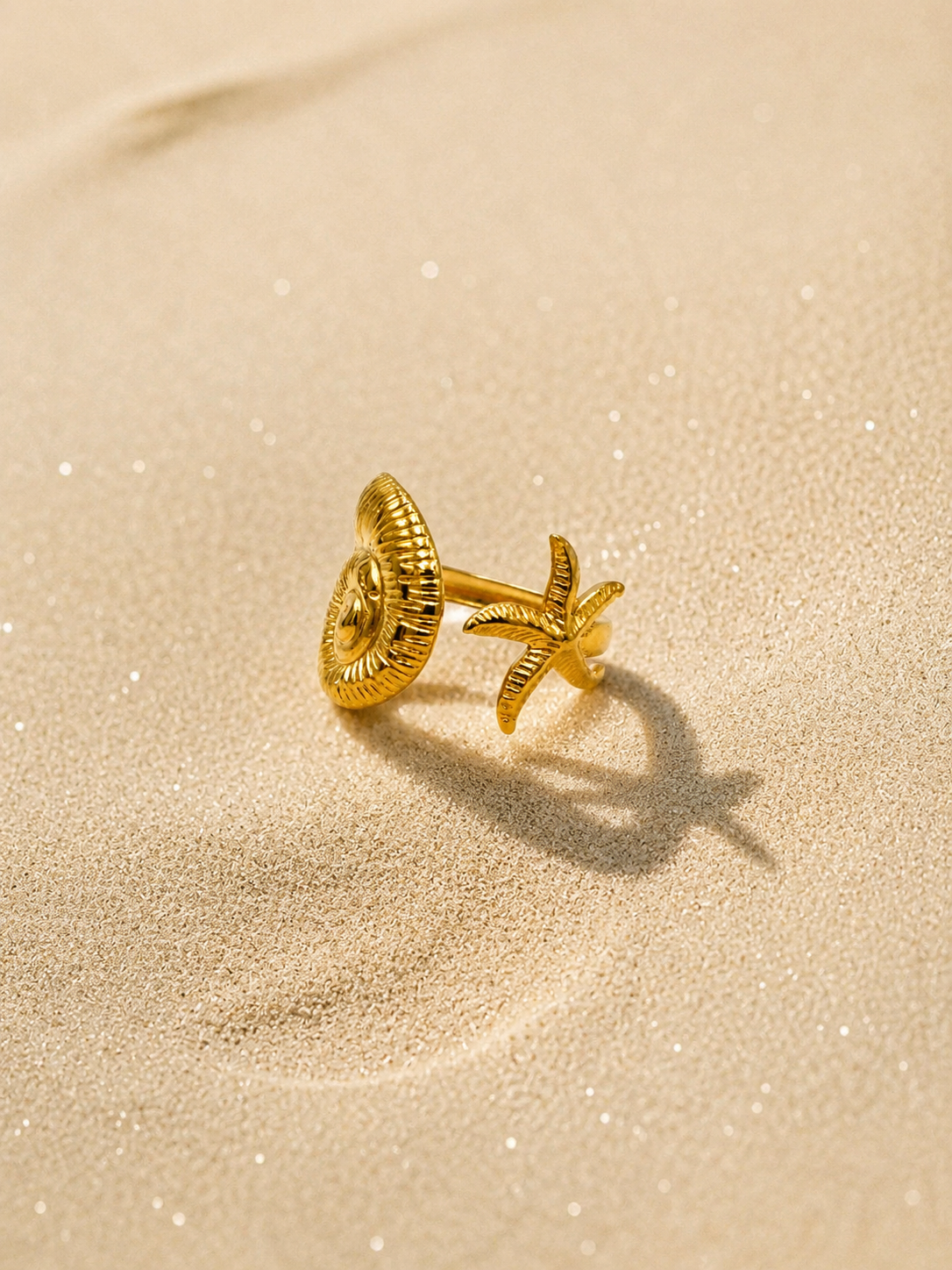 Gold-tone palm statement ring, ridged disk face and starfish post