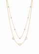 Gold necklace with heart-shaped pendants on a white background