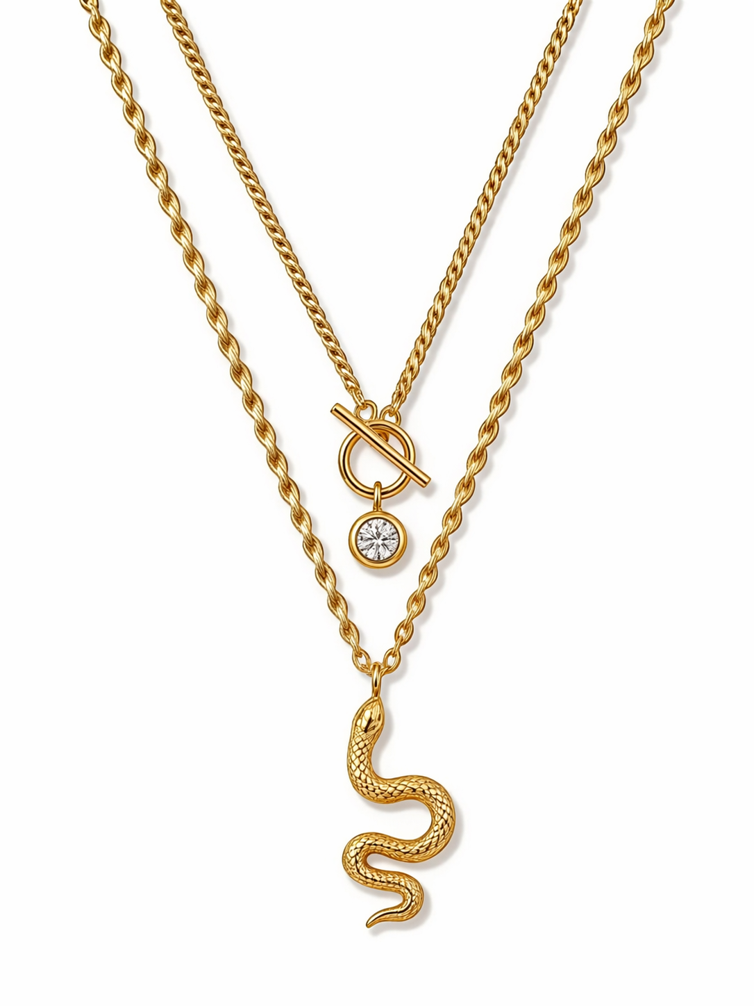 Gold-tone layered snake charm necklace with knot-style pendant and round crystal charm