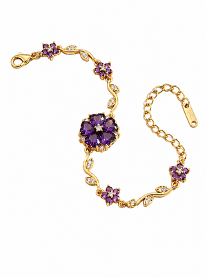Gold bracelet with purple floral charm and crystal accents, adjustable clasp