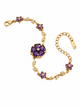 Gold bracelet with purple floral charm and crystal accents, adjustable clasp