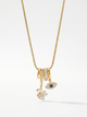 Gold charm pendant necklace with blue evil-eye enamel and small swan charms