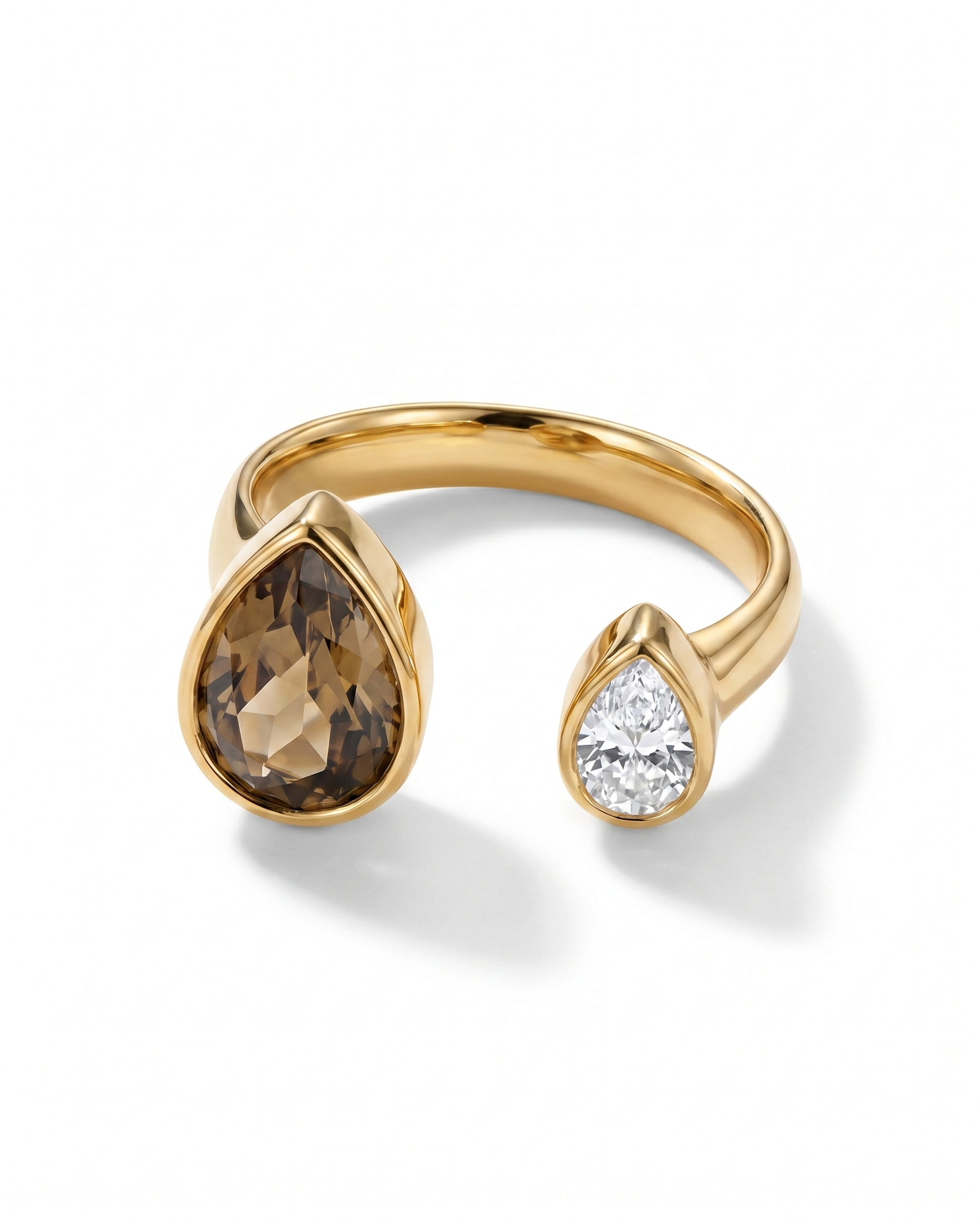 Gold open ring with large brown teardrop stone and small clear round stone